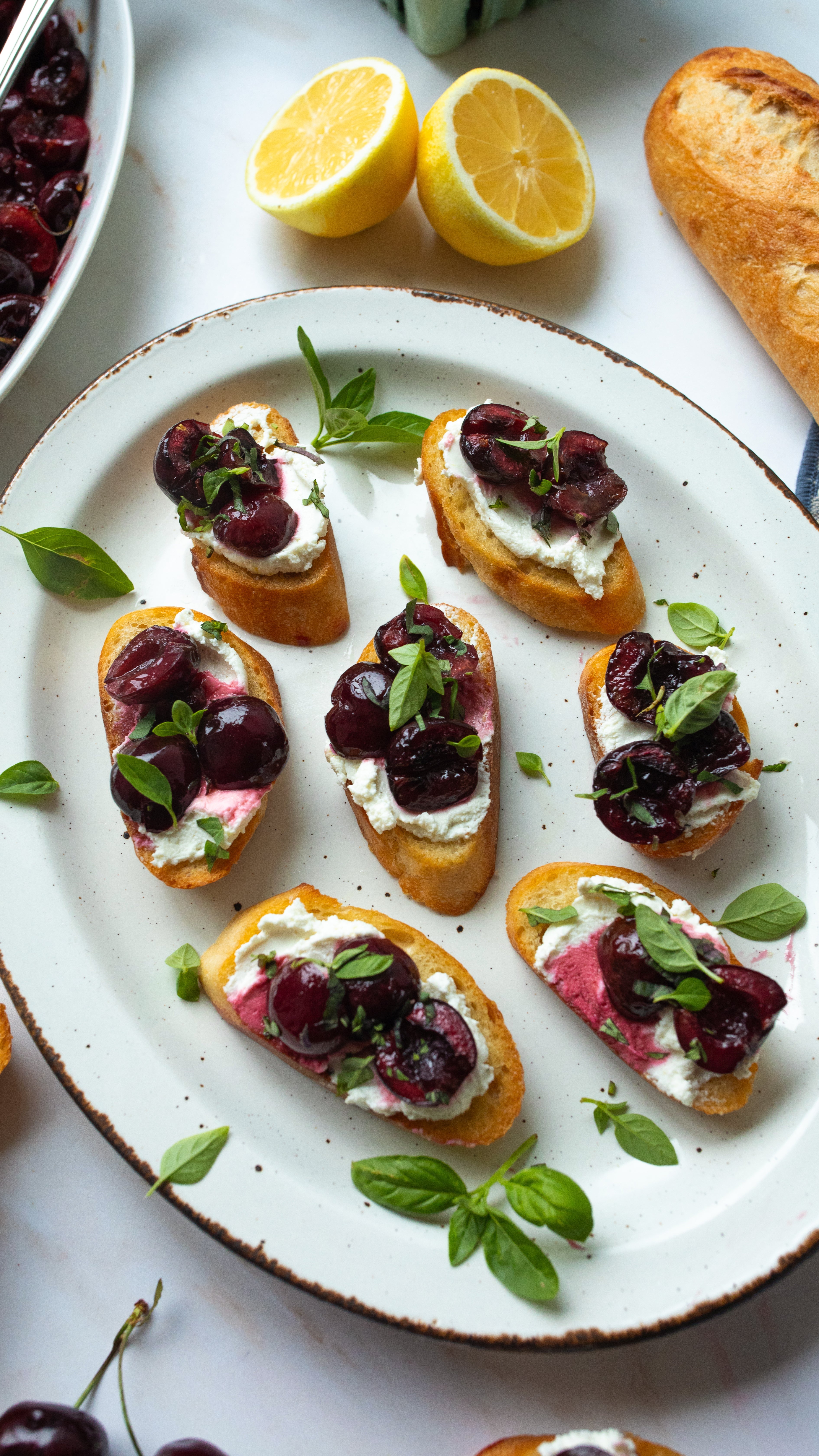 Cherry Crostinis with Lemon Goat Cheese & Basil